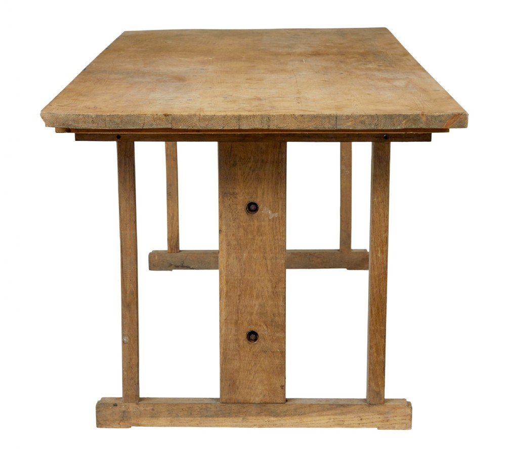 A 19th-century Swedish oak and pine trestle table with a flat rectangular top and timber stretcher base. View V