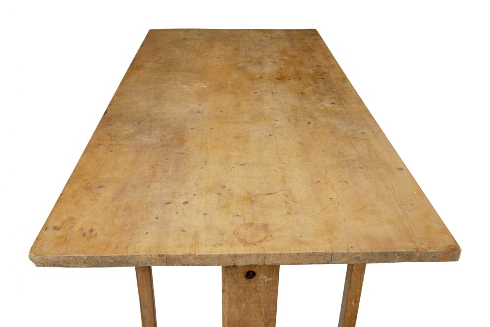 A 19th-century Swedish oak and pine trestle table with a flat rectangular top and timber stretcher base. View VI