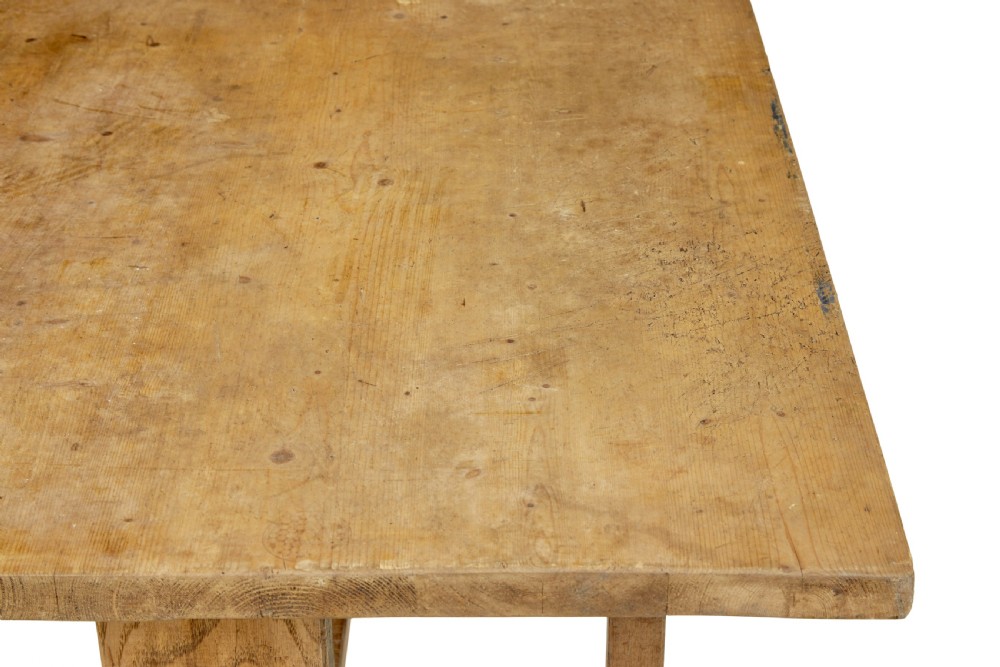 A 19th-century Swedish oak and pine trestle table with a flat rectangular top and timber stretcher base. View VII