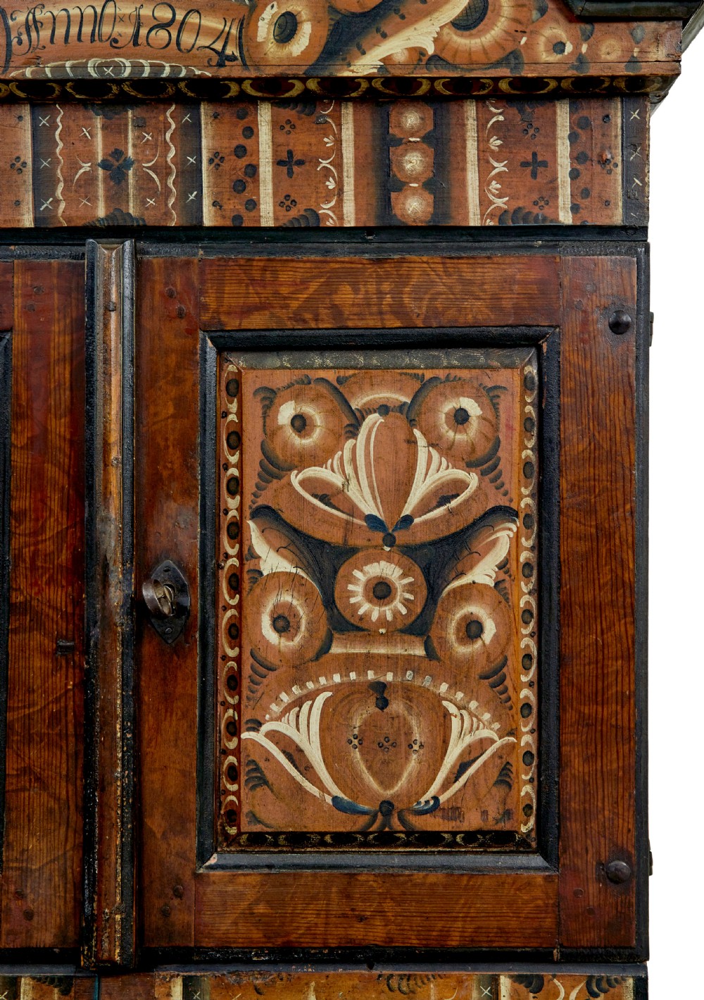 An early nineteenth-century Swedish painted wooden cupboard featuring floral folk art motifs, a shaped cornice dated 1804, and turned bun feet. View IV