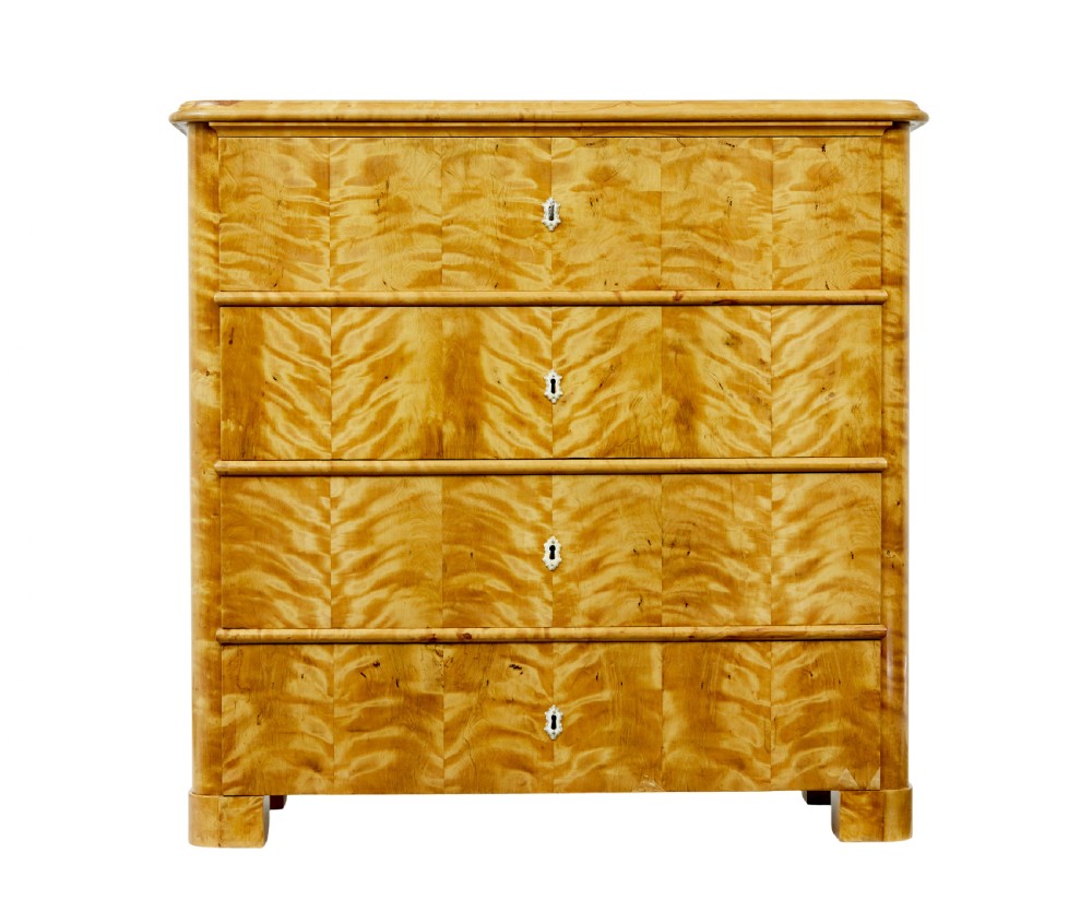 A nineteenth-century Swedish chest of drawers featuring four drawers decorated with book-matched tiger birch veneer and small white escutcheons. View III