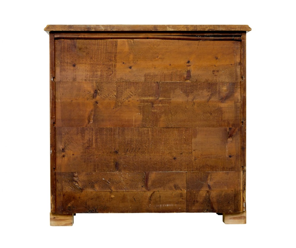 A nineteenth-century Swedish chest of drawers featuring four drawers decorated with book-matched tiger birch veneer and small white escutcheons. View V
