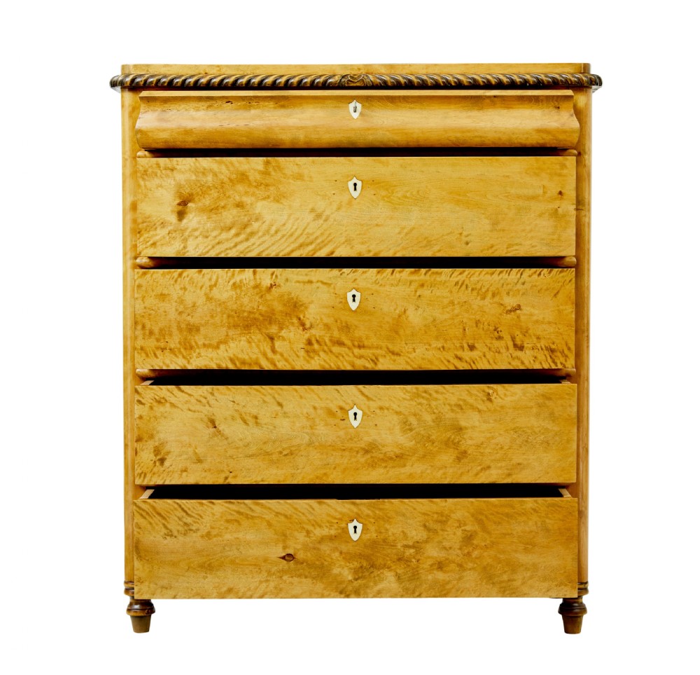 A 19th-century Swedish birch chest featuring five graduated drawers with keyhole escutcheons, rope-carved moulding under the top edge, and turned feet. View III