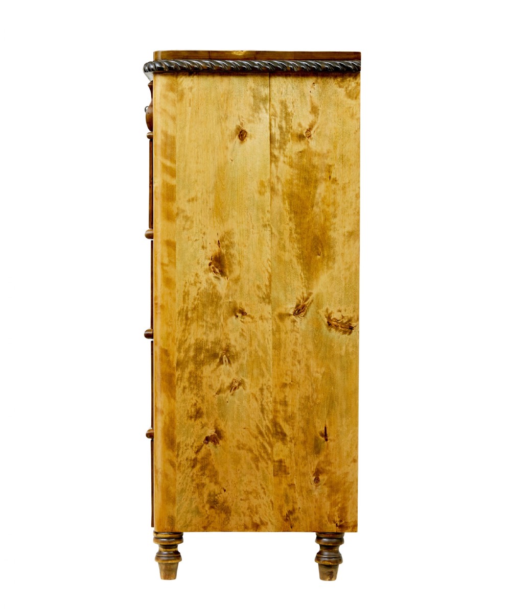 A 19th-century Swedish birch chest featuring five graduated drawers with keyhole escutcheons, rope-carved moulding under the top edge, and turned feet. View V