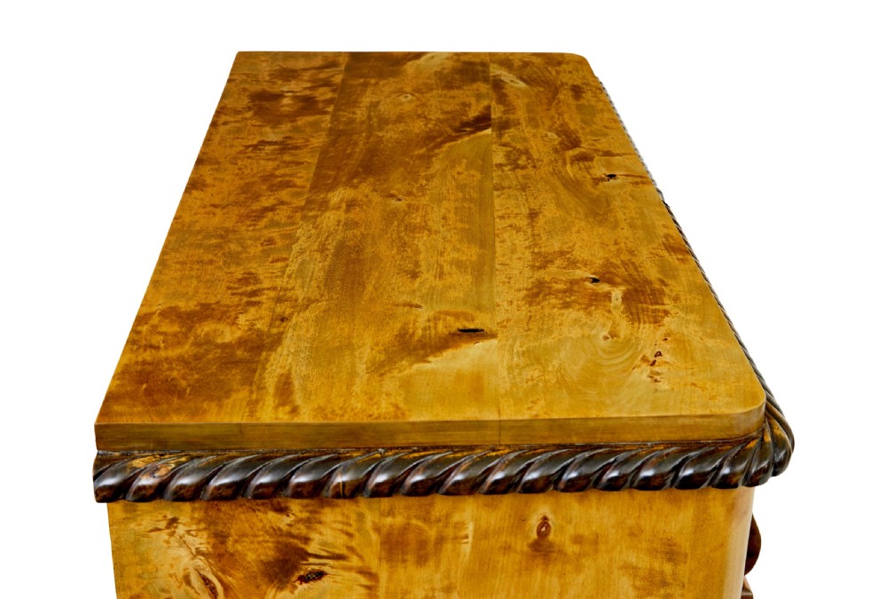 A 19th-century Swedish birch chest featuring five graduated drawers with keyhole escutcheons, rope-carved moulding under the top edge, and turned feet. View VIII