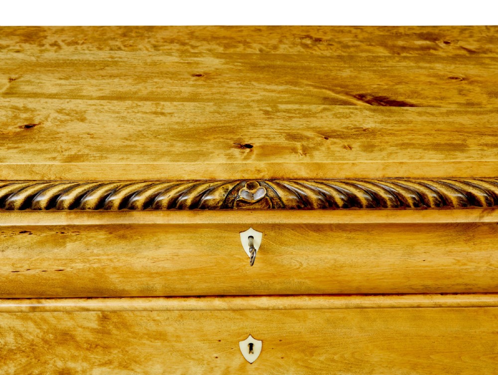 A 19th-century Swedish birch chest featuring five graduated drawers with keyhole escutcheons, rope-carved moulding under the top edge, and turned feet. View IX