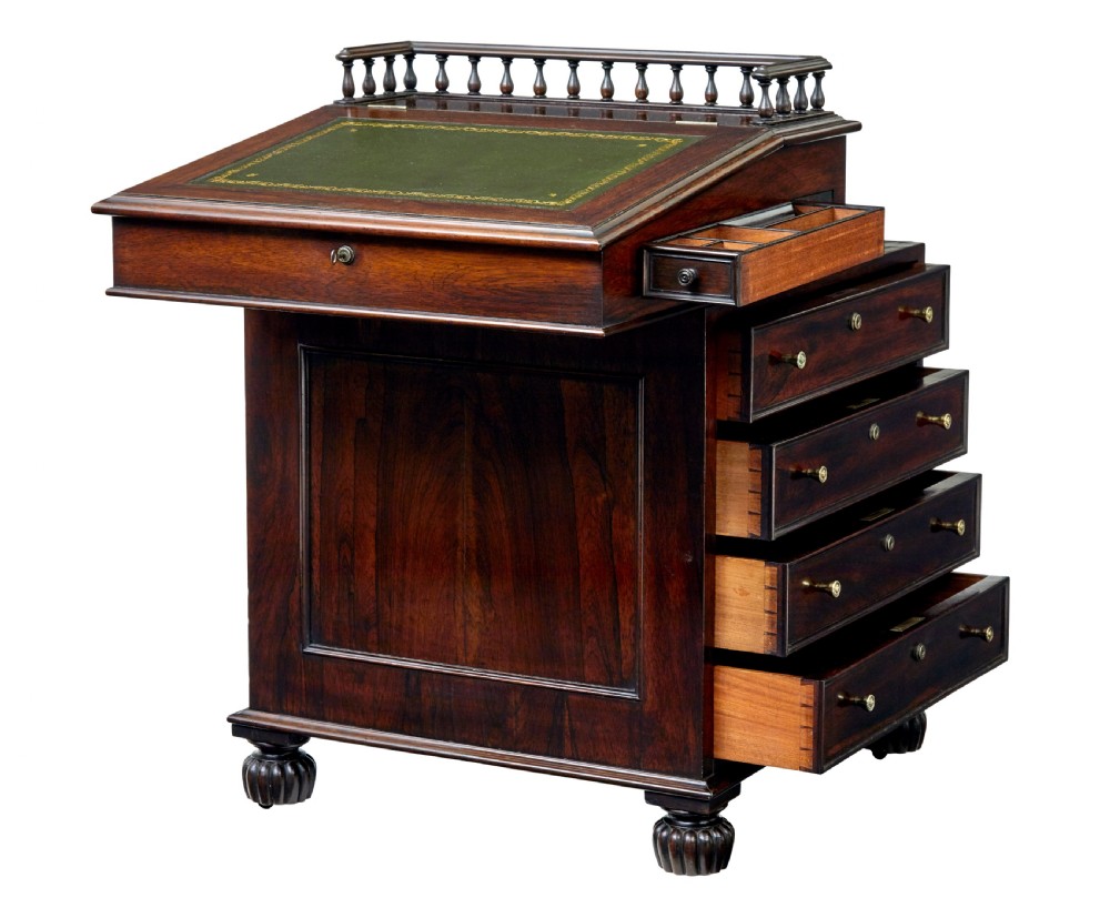 A mid-19th-century dark mahogany Davenport writing desk with a green leather gilded slant top, side drawers, and a balustrade gallery. View II