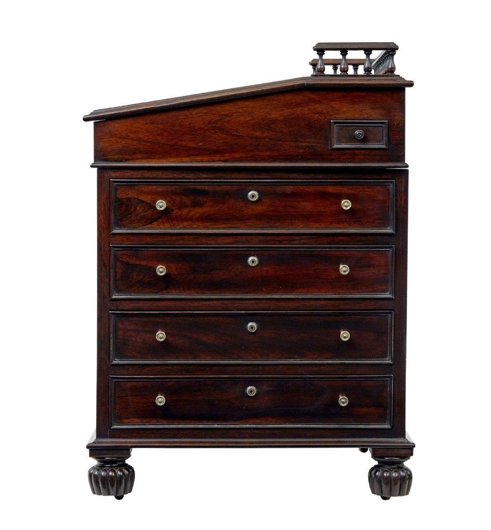A mid-19th-century dark mahogany Davenport writing desk with a green leather gilded slant top, side drawers, and a balustrade gallery. View IV