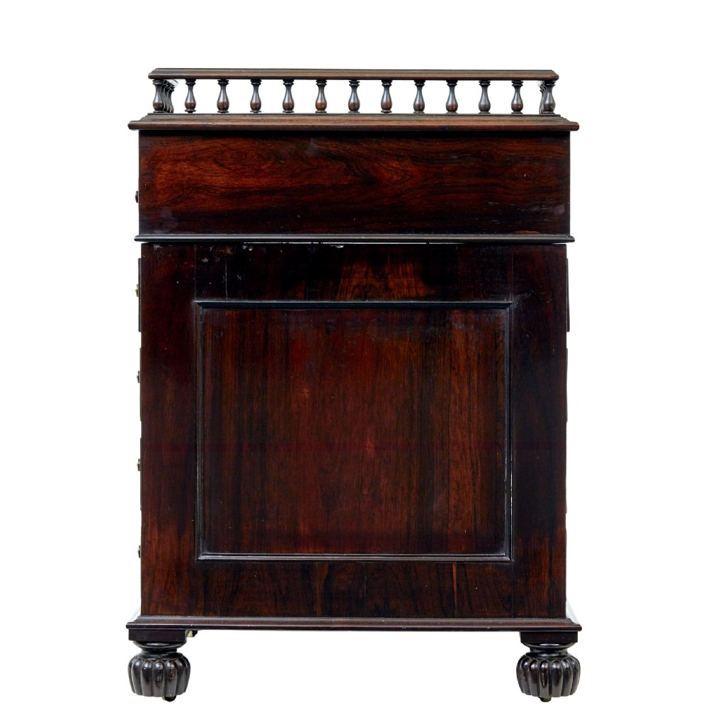 A mid-19th-century dark mahogany Davenport writing desk with a green leather gilded slant top, side drawers, and a balustrade gallery. View V