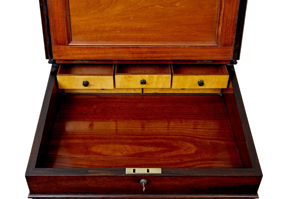 A mid-19th-century dark mahogany Davenport writing desk with a green leather gilded slant top, side drawers, and a balustrade gallery. View IX