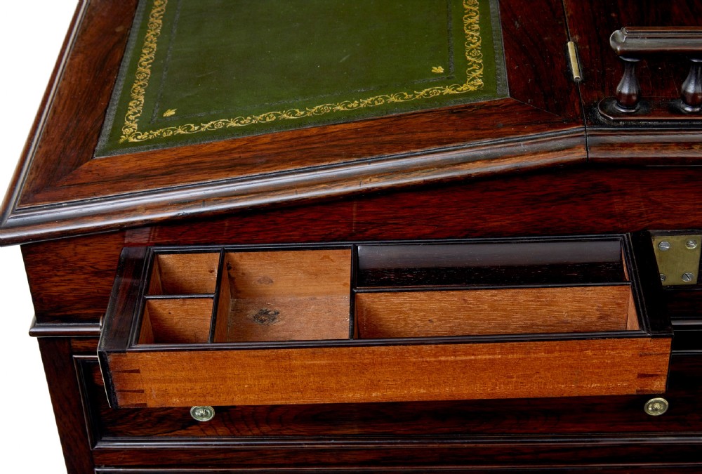 A mid-19th-century dark mahogany Davenport writing desk with a green leather gilded slant top, side drawers, and a balustrade gallery. View X
