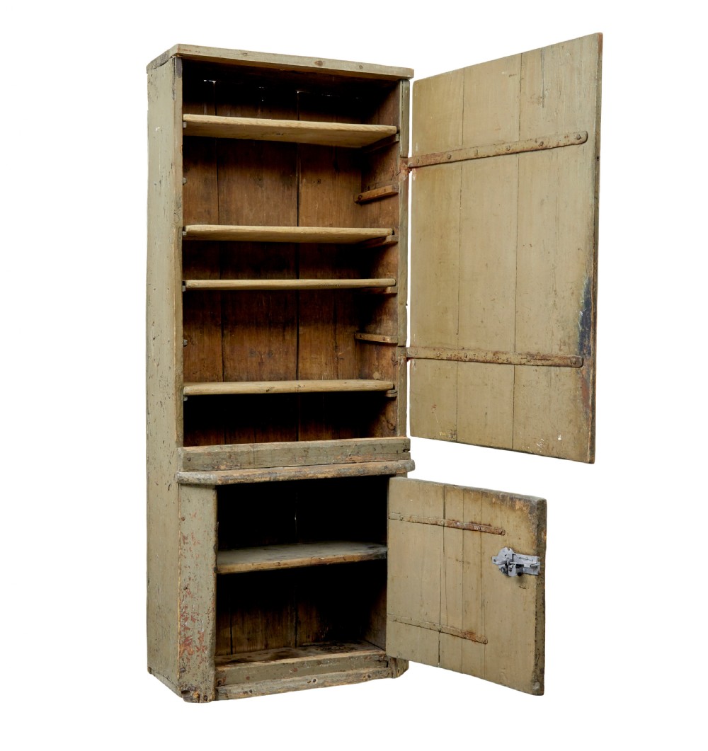 A tall early 19th-century Scandinavian pine cupboard featuring two doors with reeded panelling and a distressed pale green painted finish. View II