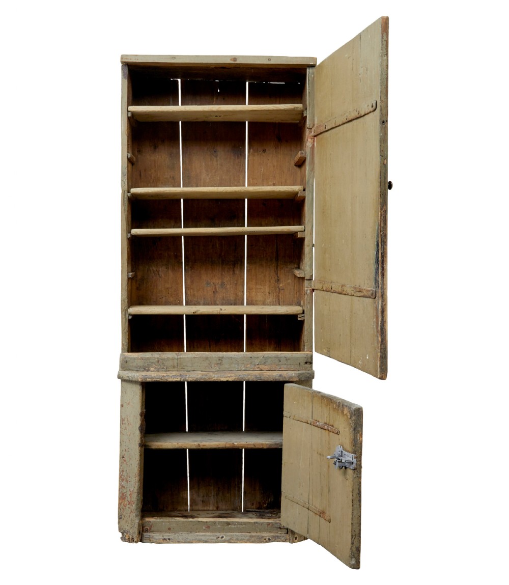 A tall early 19th-century Scandinavian pine cupboard featuring two doors with reeded panelling and a distressed pale green painted finish. View III