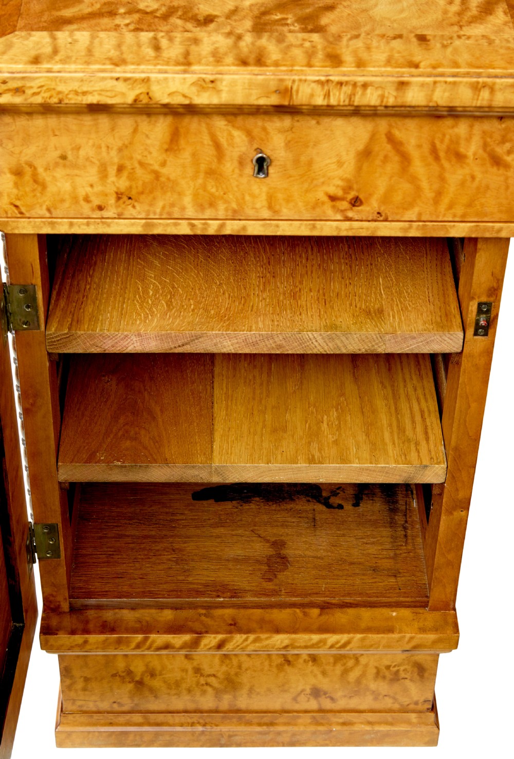 An Art Deco twin-pedestalled desk crafted from golden flame birch veneer featuring multiple drawers, cupboard doors, and decorative reeded borders. View XI