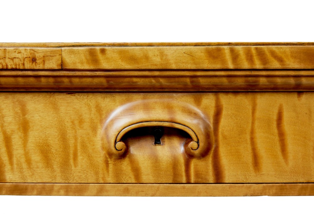 An Art Deco twin-pedestalled desk crafted from golden flame birch veneer featuring multiple drawers, cupboard doors, and decorative reeded borders. View XII