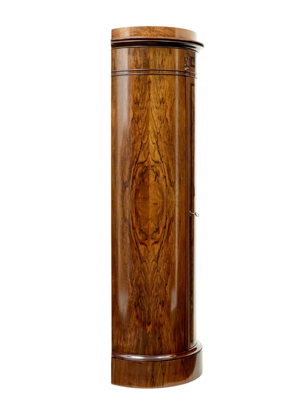 A 19th-century cylindrical burr walnut pedestal cupboard featuring geometric dark stringing and a single door with a key. View IV