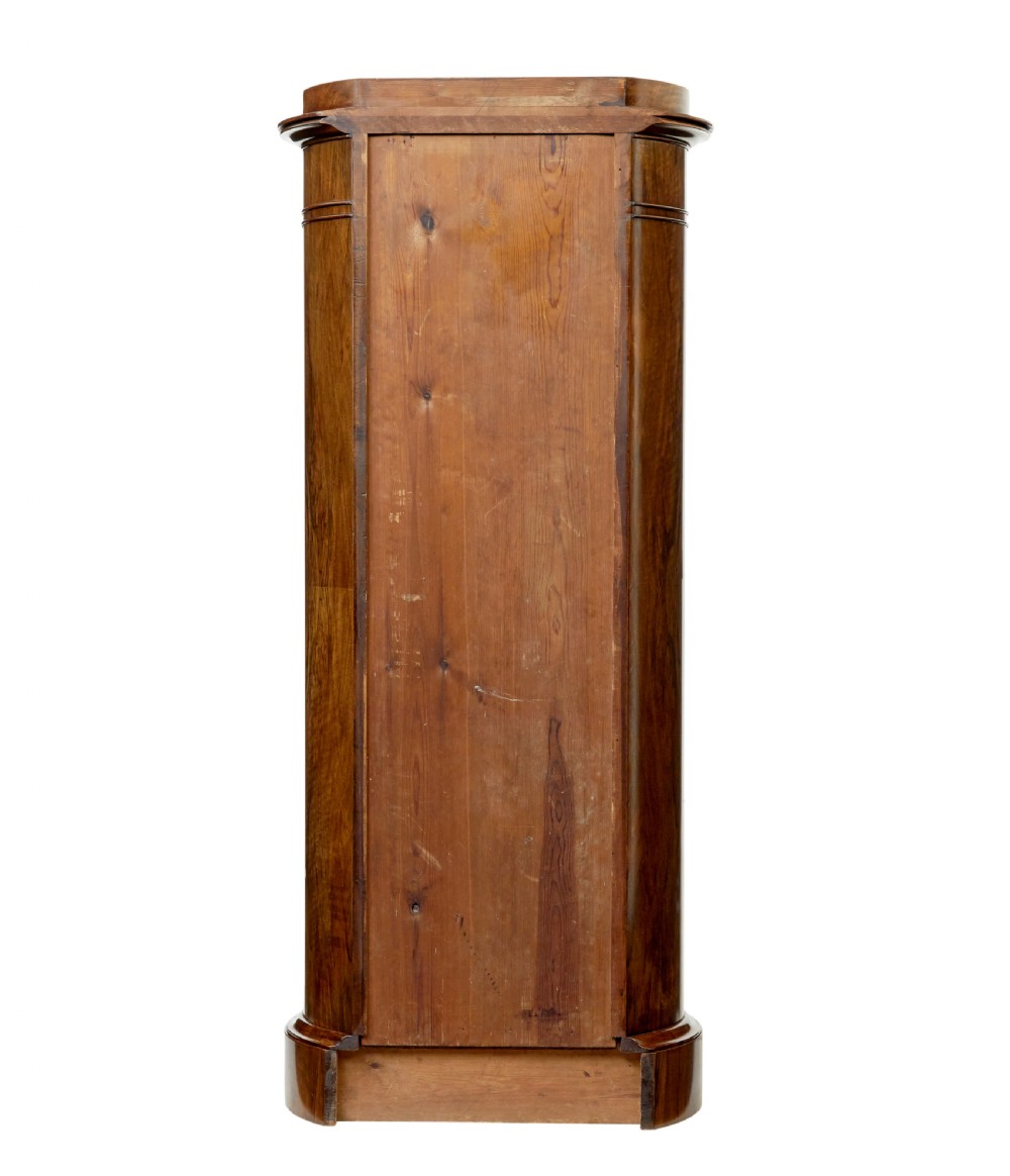A 19th-century cylindrical burr walnut pedestal cupboard featuring geometric dark stringing and a single door with a key. View V
