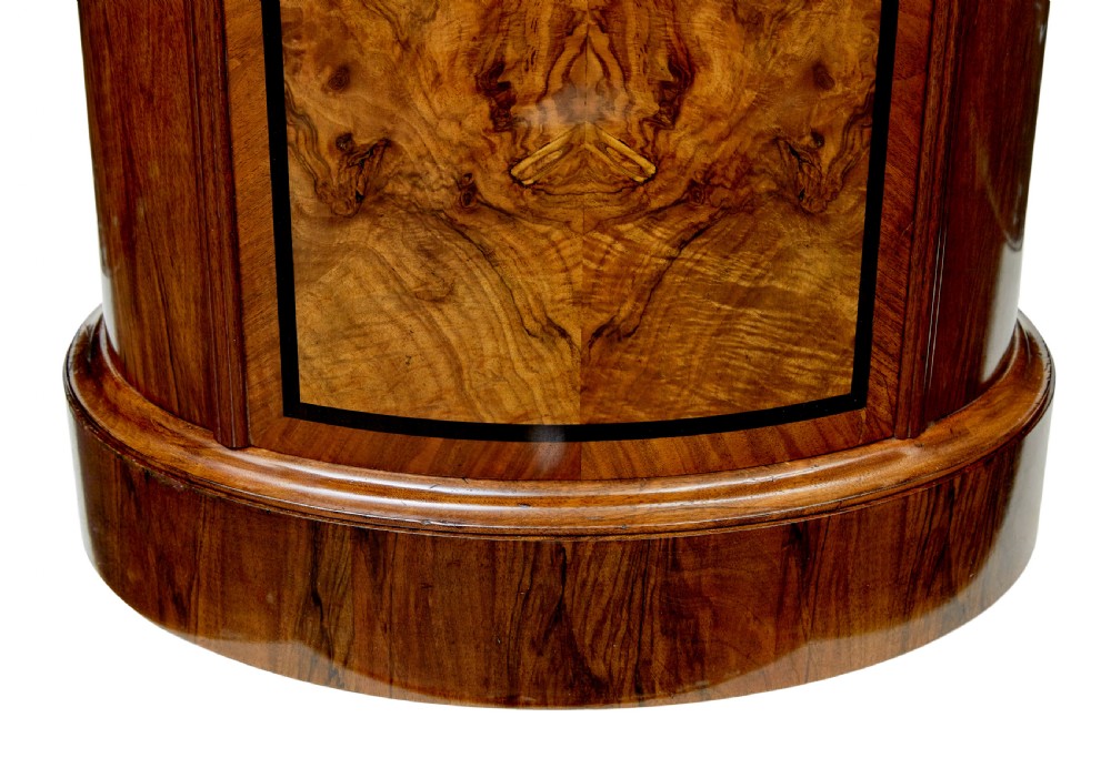A 19th-century cylindrical burr walnut pedestal cupboard featuring geometric dark stringing and a single door with a key. View IX