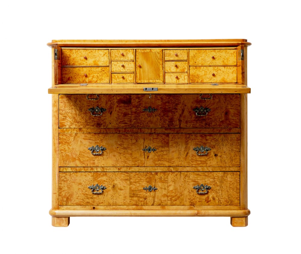 A mid-19th-century Swedish secretaire chest featuring highly figured burr birch veneers, four horizontal drawers, ornate brass handles, and block feet. View II