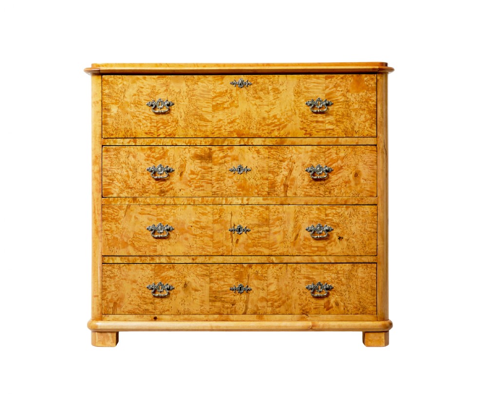 A mid-19th-century Swedish secretaire chest featuring highly figured burr birch veneers, four horizontal drawers, ornate brass handles, and block feet. View III