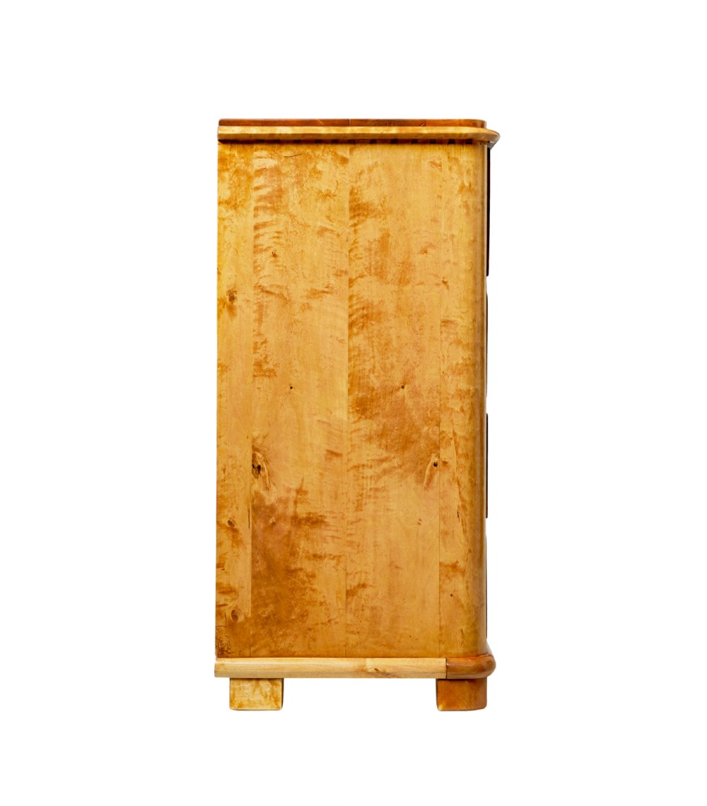 A mid-19th-century Swedish secretaire chest featuring highly figured burr birch veneers, four horizontal drawers, ornate brass handles, and block feet. View VI