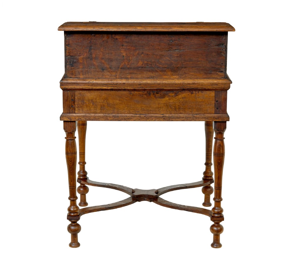 An early 19th-century Dutch oak writing desk on turned legs featuring geometric inlaid borders and a sloped writing lid above a single drawer. View V