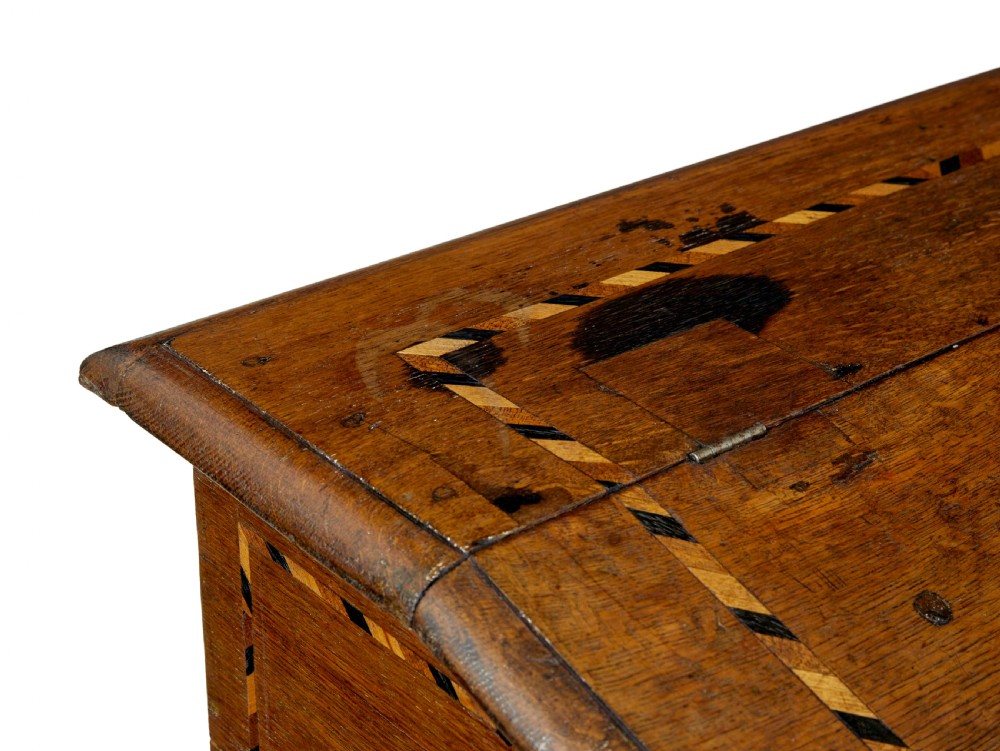 An early 19th-century Dutch oak writing desk on turned legs featuring geometric inlaid borders and a sloped writing lid above a single drawer. View VII