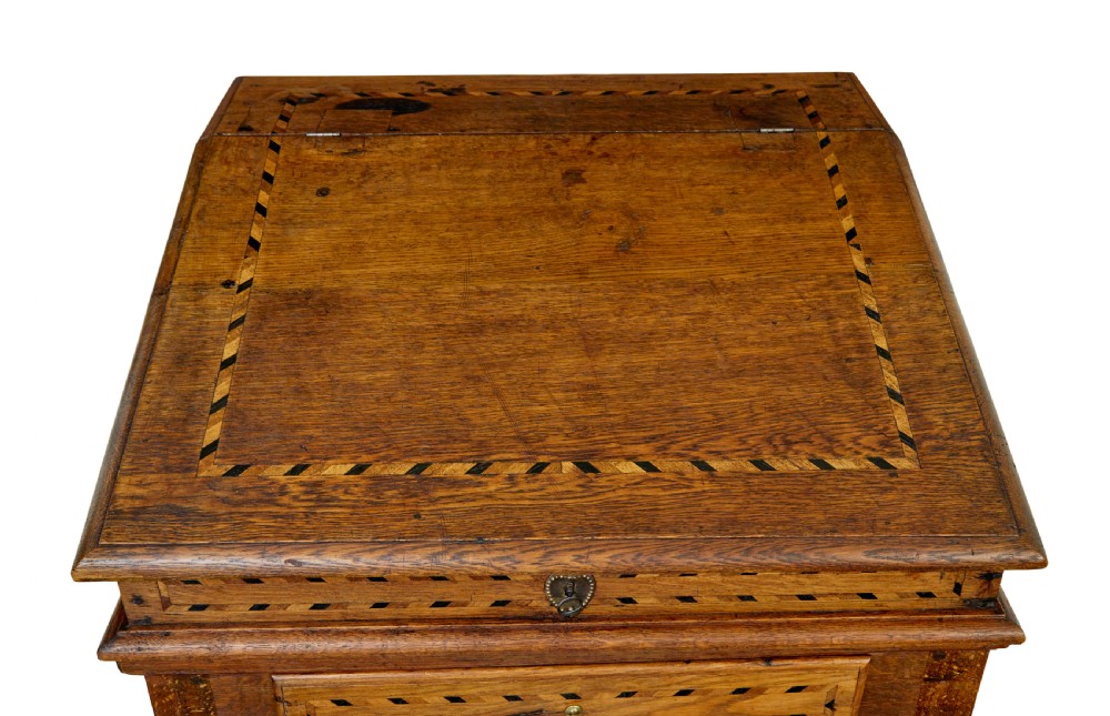 An early 19th-century Dutch oak writing desk on turned legs featuring geometric inlaid borders and a sloped writing lid above a single drawer. View VIII