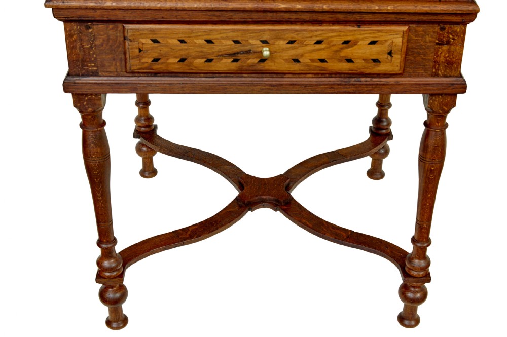An early 19th-century Dutch oak writing desk on turned legs featuring geometric inlaid borders and a sloped writing lid above a single drawer. View XI