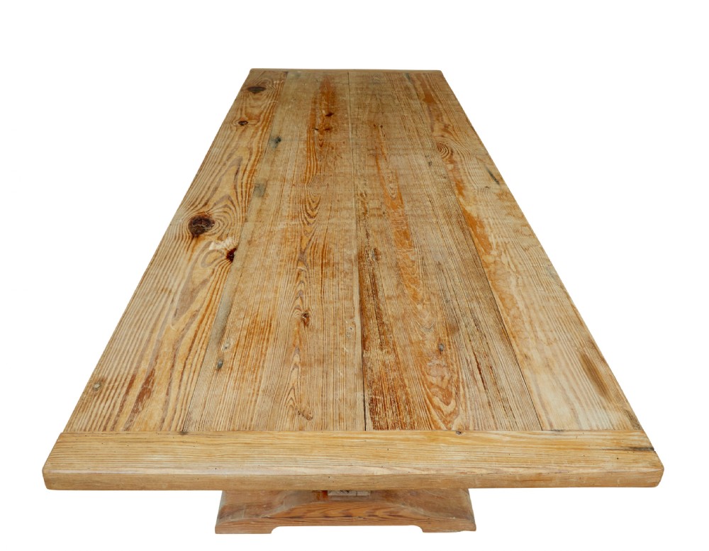 A nineteenth-century pine refectory dining table featuring a plank top, carved baluster supports, and a low central floor stretcher. View IX