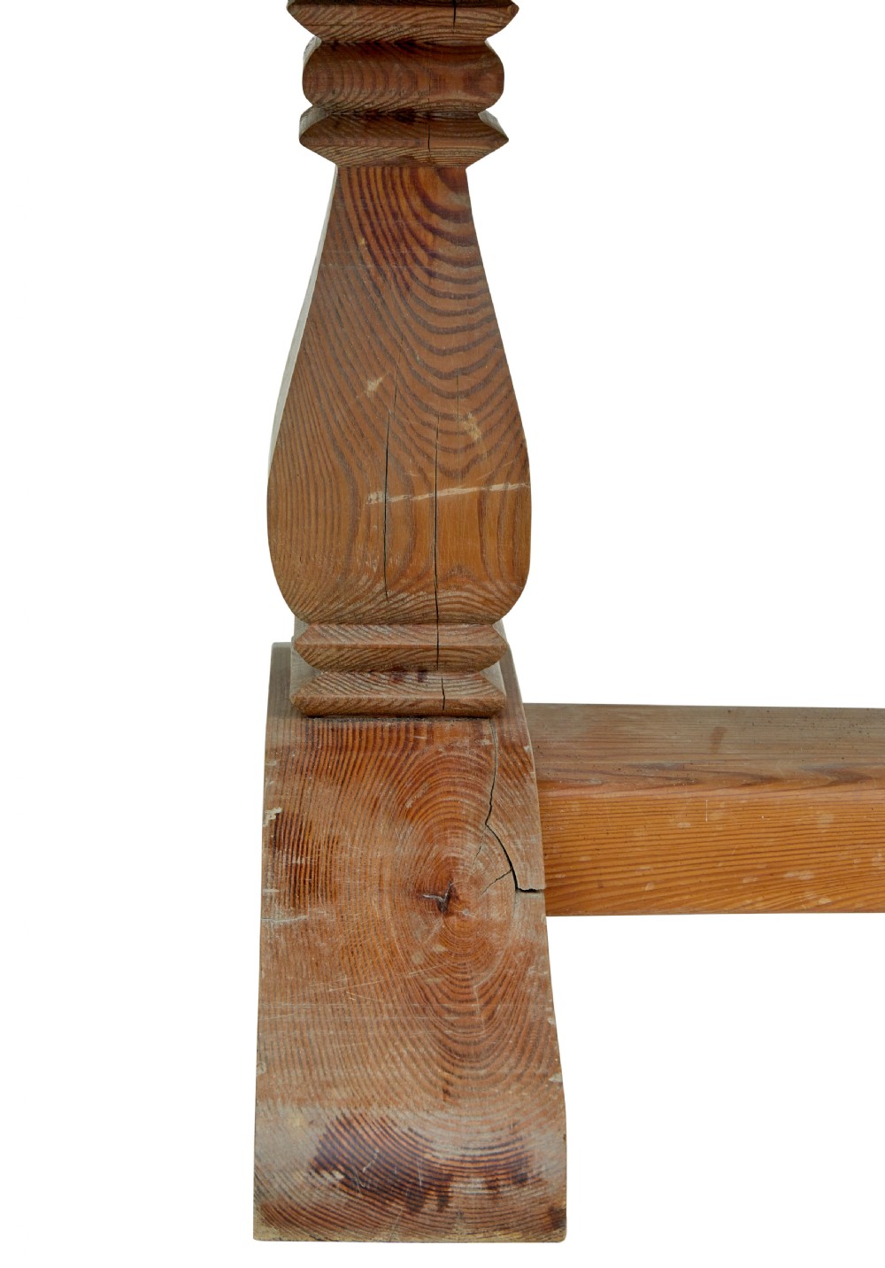 A nineteenth-century pine refectory dining table featuring a plank top, carved baluster supports, and a low central floor stretcher. View XI