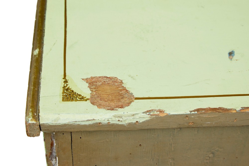 A 19th-century Swedish sage green painted pine chest of drawers with two short drawers over three long drawers and brass keyhole escutcheons. View II