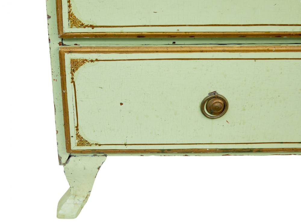 A 19th-century Swedish sage green painted pine chest of drawers with two short drawers over three long drawers and brass keyhole escutcheons. View X