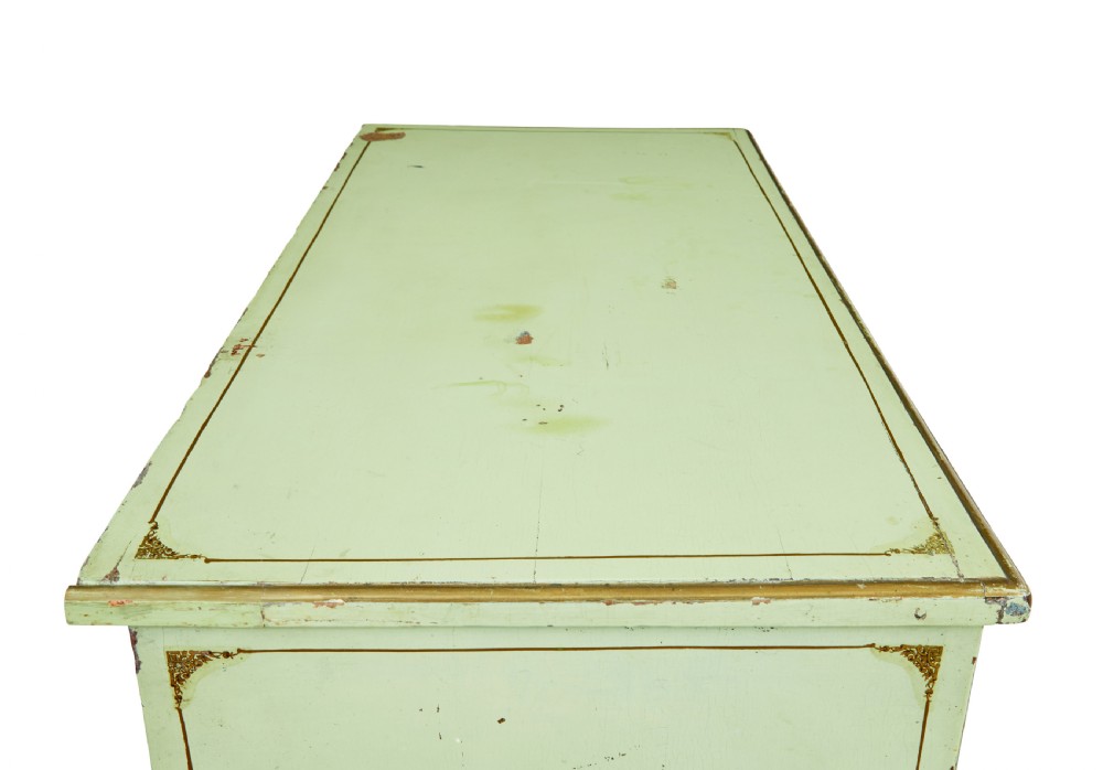 A 19th-century Swedish sage green painted pine chest of drawers with two short drawers over three long drawers and brass keyhole escutcheons. View XII