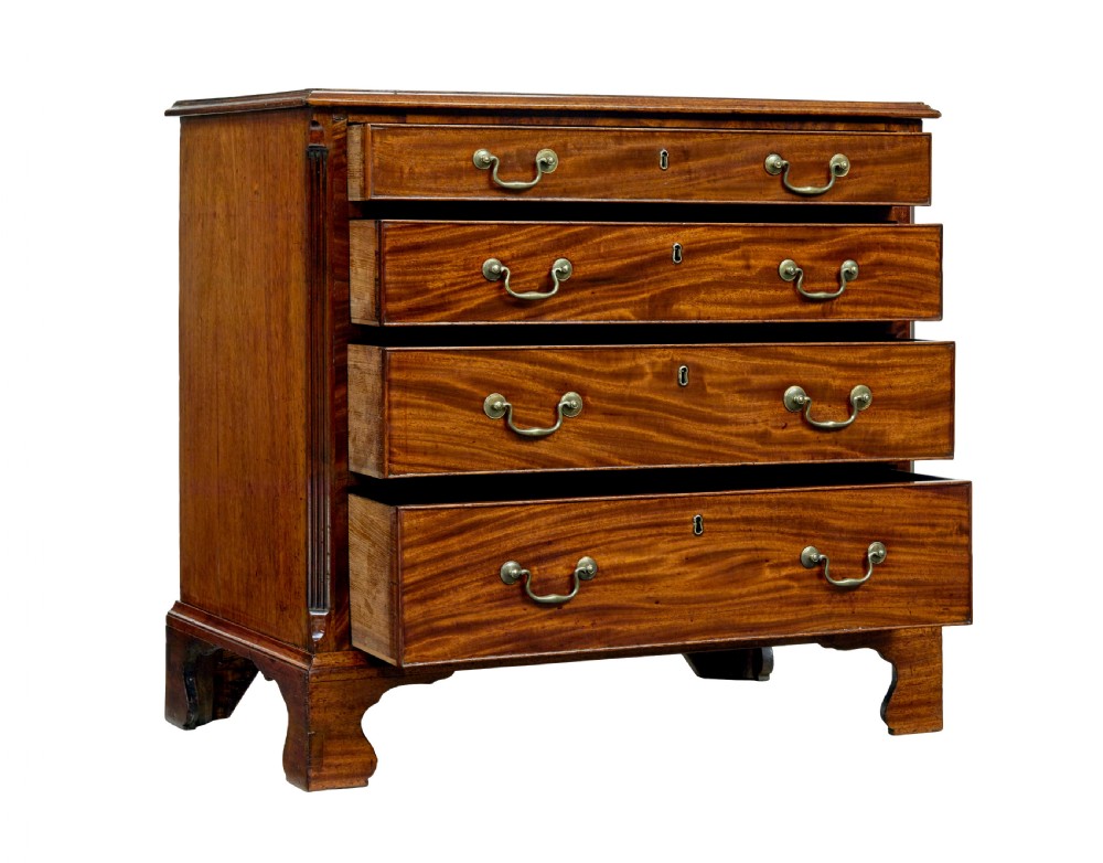 An early 19th-century Georgian mahogany chest of drawers featuring four graduated drawers with brass swan-neck handles and bracket feet. View II