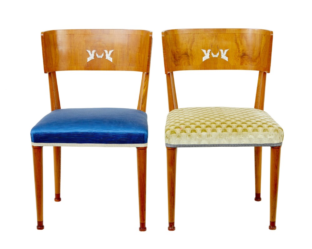 A set of Swedish Art Deco elm klismos dining chairs featuring curved backrests with marquetry inlays and upholstered seats in blue and patterned fabrics. View II