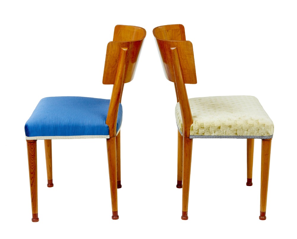 A set of Swedish Art Deco elm klismos dining chairs featuring curved backrests with marquetry inlays and upholstered seats in blue and patterned fabrics. View III