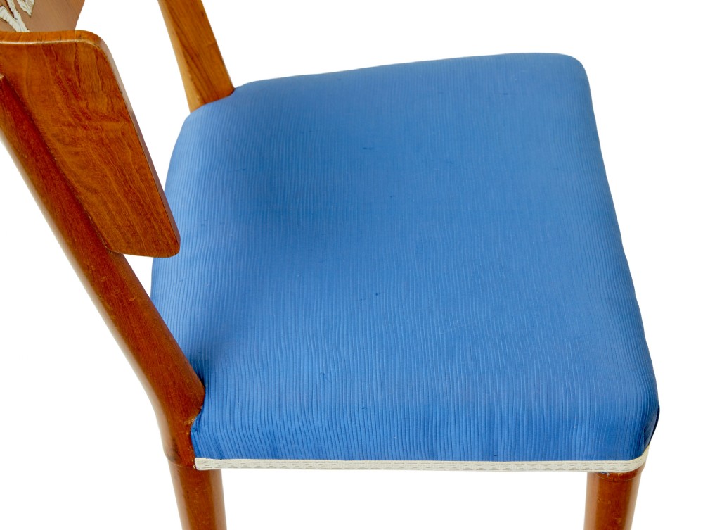 A set of Swedish Art Deco elm klismos dining chairs featuring curved backrests with marquetry inlays and upholstered seats in blue and patterned fabrics. View VII