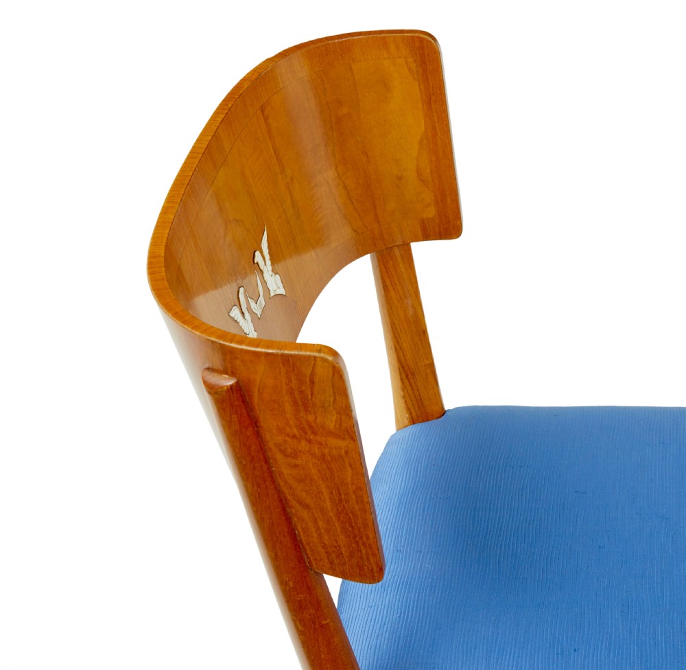 A set of Swedish Art Deco elm klismos dining chairs featuring curved backrests with marquetry inlays and upholstered seats in blue and patterned fabrics. View VIII