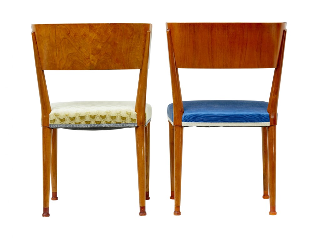 A set of Swedish Art Deco elm klismos dining chairs featuring curved backrests with marquetry inlays and upholstered seats in blue and patterned fabrics. View X