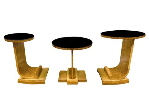 fig 1. A set of three 1930s Art Deco nesting side tables featuring blonde birds-eye maple curved J-shaped frames and circular black glass insert tops.