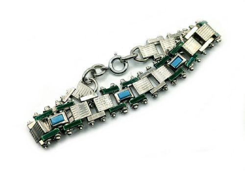 fig 2. An Art Deco chrome-plated link bracelet featuring green and light blue geometric enamel detailing.