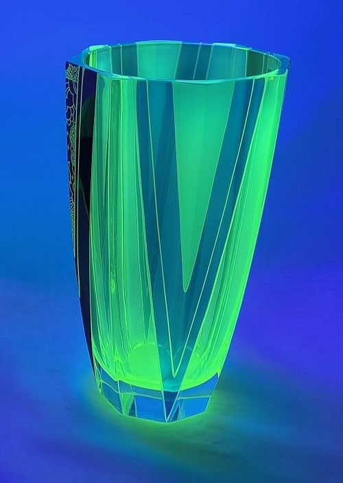 fig 1. An Art Deco geometric uranium glass vase featuring black enamel triangular accents and etched abstract patterns.