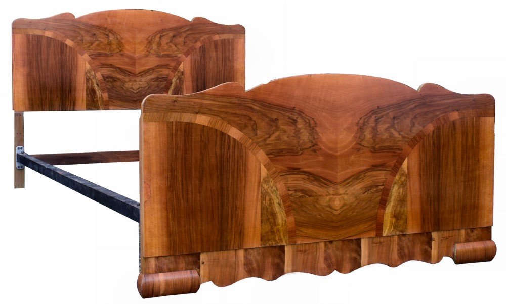 An Art Deco double bed frame featuring an arched cloud-shaped headboard and matching footboard with symmetrical book-matched walnut veneer. View II