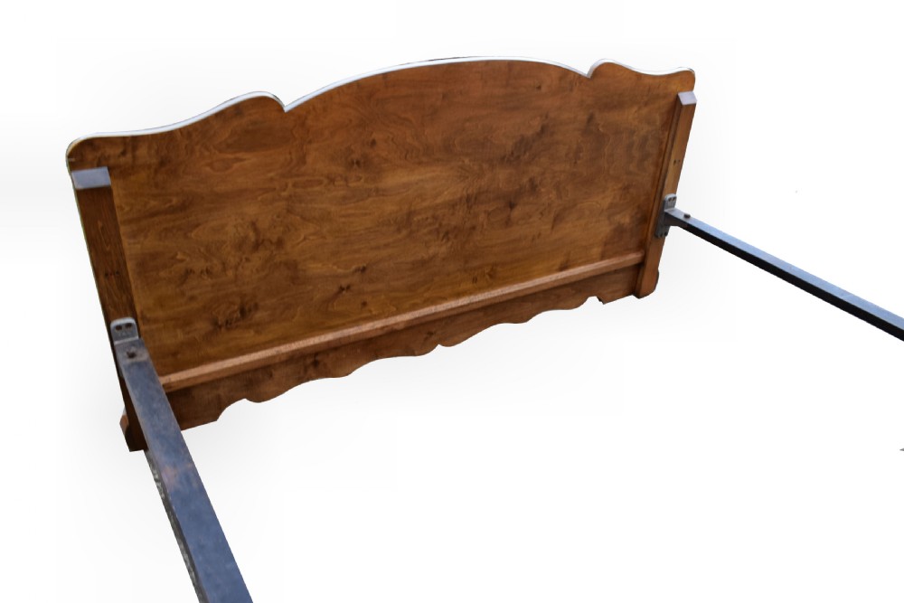 An Art Deco double bed frame featuring an arched cloud-shaped headboard and matching footboard with symmetrical book-matched walnut veneer. View VIII