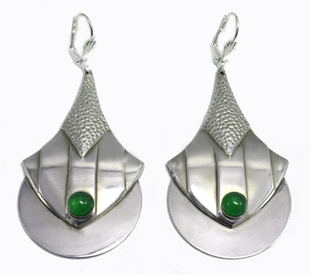 A pair of Art Deco style silver-plated drop earrings featuring geometric fan shapes, hammered detailing, and round green glass cabochons. View IV