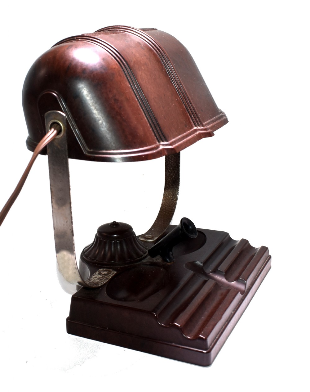 A dark brown mottled Bakelite desk lamp featuring a ribbed dome shade, curved metal arm, and an integrated pen tray base.