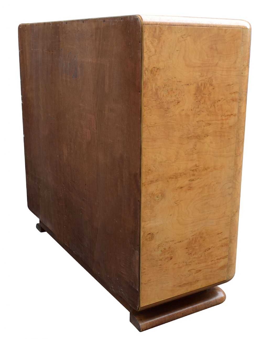 A two-door 1930s Art Deco bedroom cabinet featuring curved corners, figured blonde wood veneer, and low plinth feet. View VII
