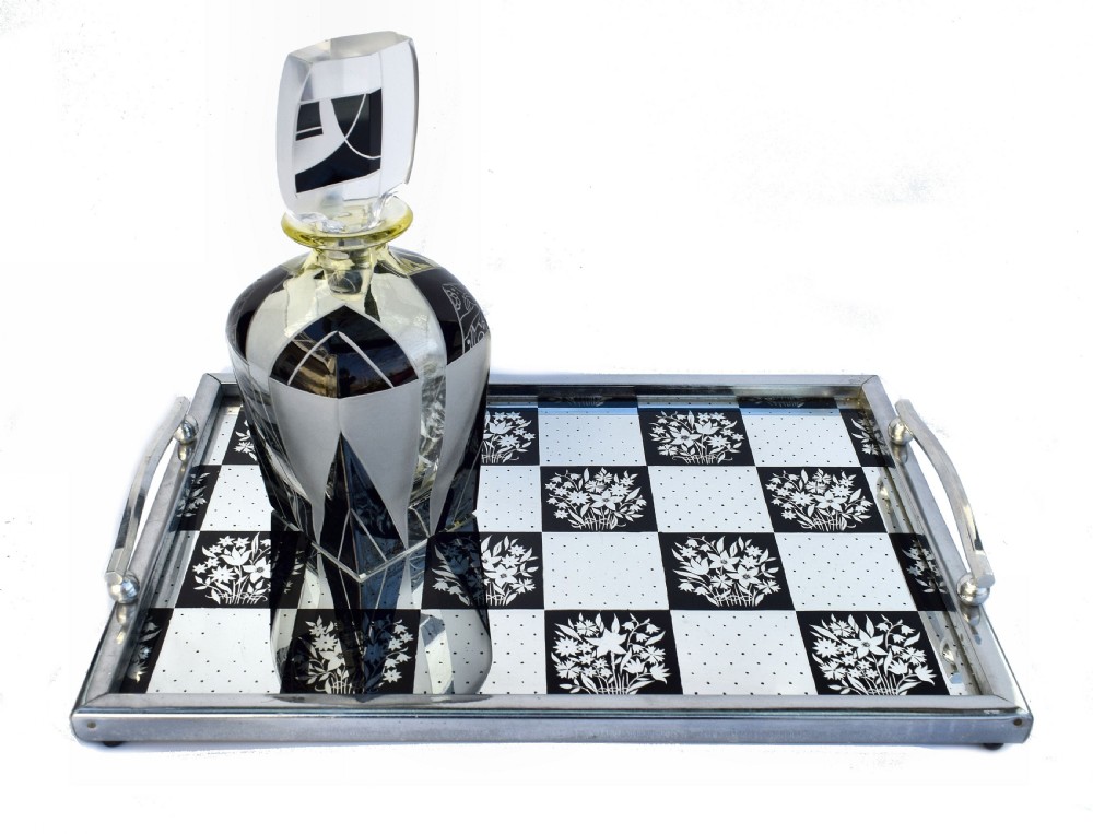 A rectangular Art Deco chrome drinks tray featuring a black and white checkerboard mirrored glass surface decorated with floral motifs and geometric dots. View II