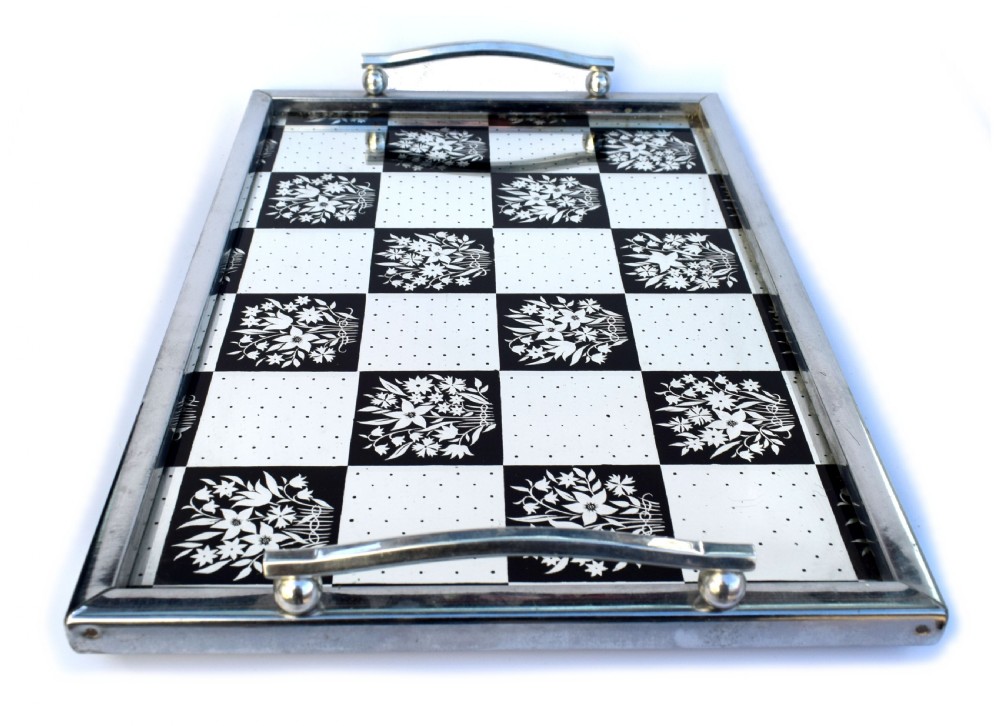 A rectangular Art Deco chrome drinks tray featuring a black and white checkerboard mirrored glass surface decorated with floral motifs and geometric dots. View III